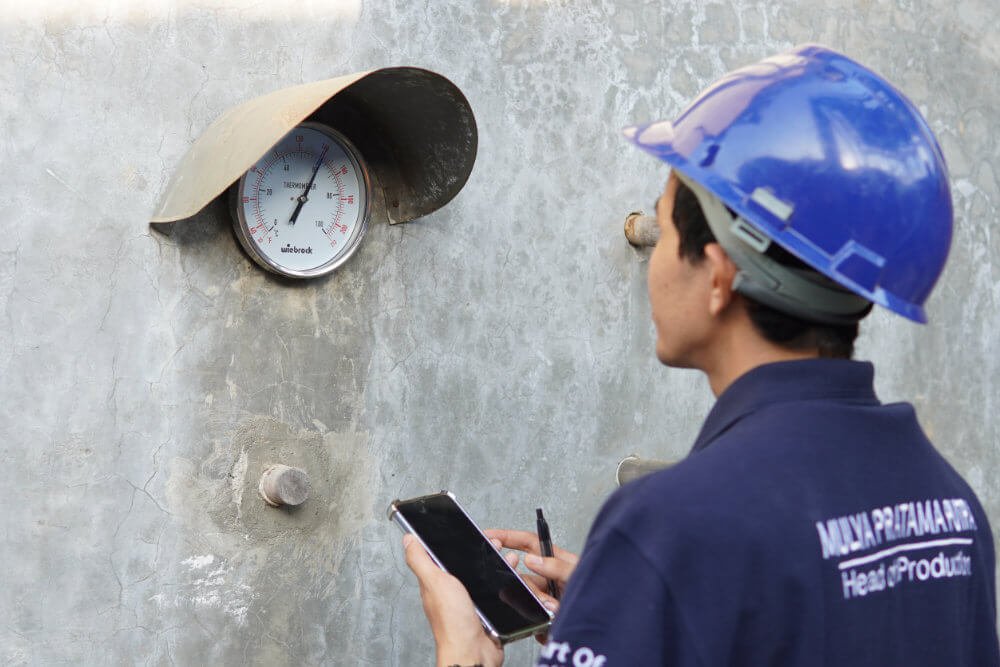 worker are checking the wood heater temperature