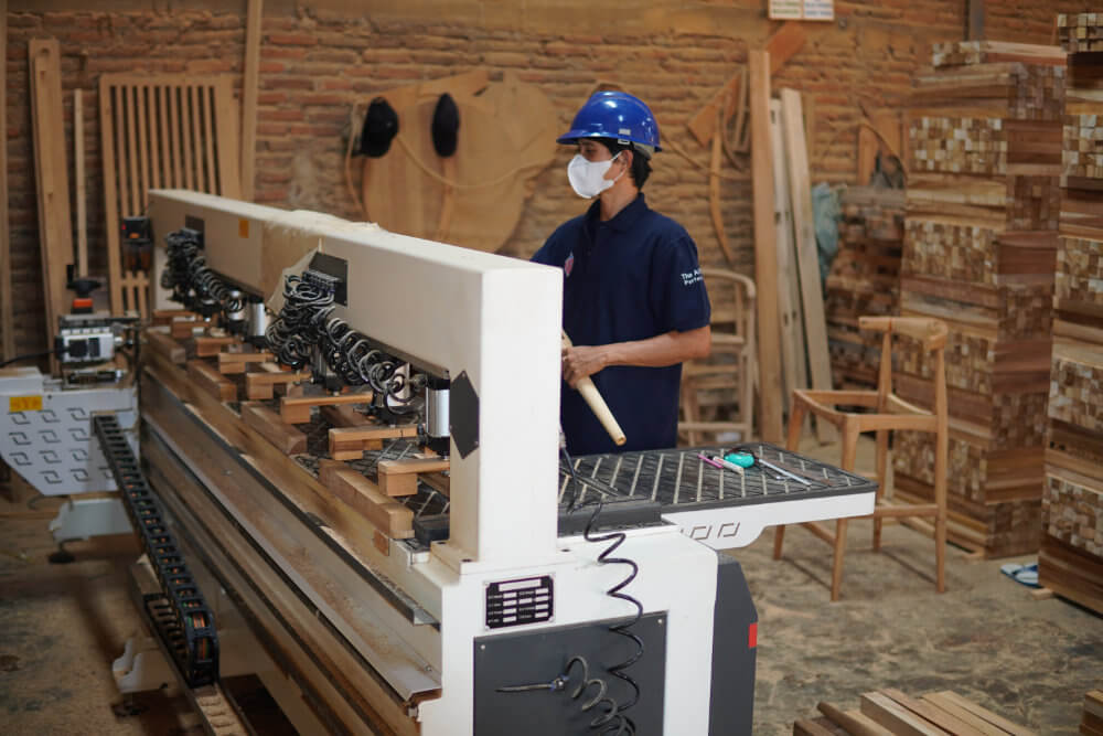 Worker with CNC Mortise Machine