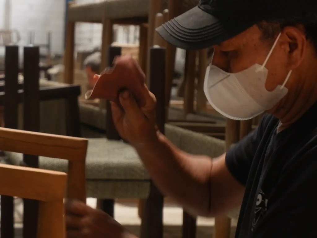 an artisan working a Teak Outdoor Furniture Indonesia at MPP Furniture - Indonesian Furniture Supplier