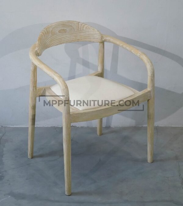Custom upholstered dining chair, the Crescent model, shown in a light whitewashed Mindi wood finish with a cream fabric cushion for a coastal look. Made by Custom Furniture Manufacturer MPP Furniture
