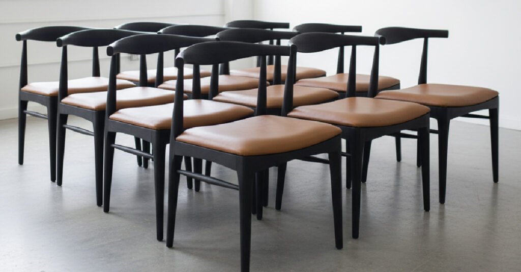 A finished batch of identical custom chairs ready for delivery from a Custom Furniture Manufacturer, showing consistency and quality control.