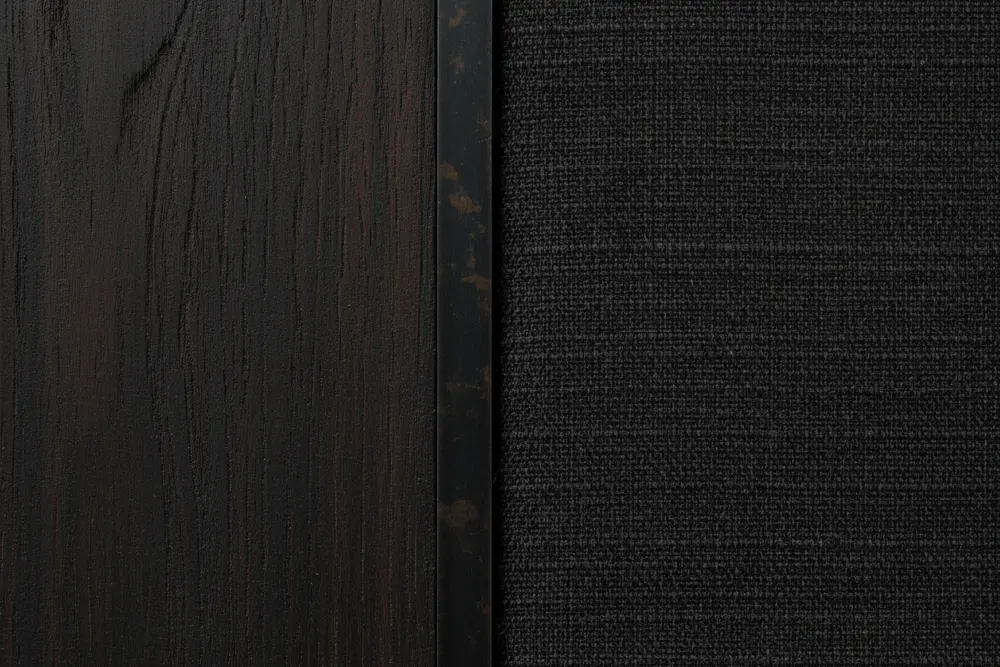 Macro view of textured materials: extreme close-up of deeply distressed dark Wabi Sabi wood grain next to black raw linen and oxidized metal inlay.