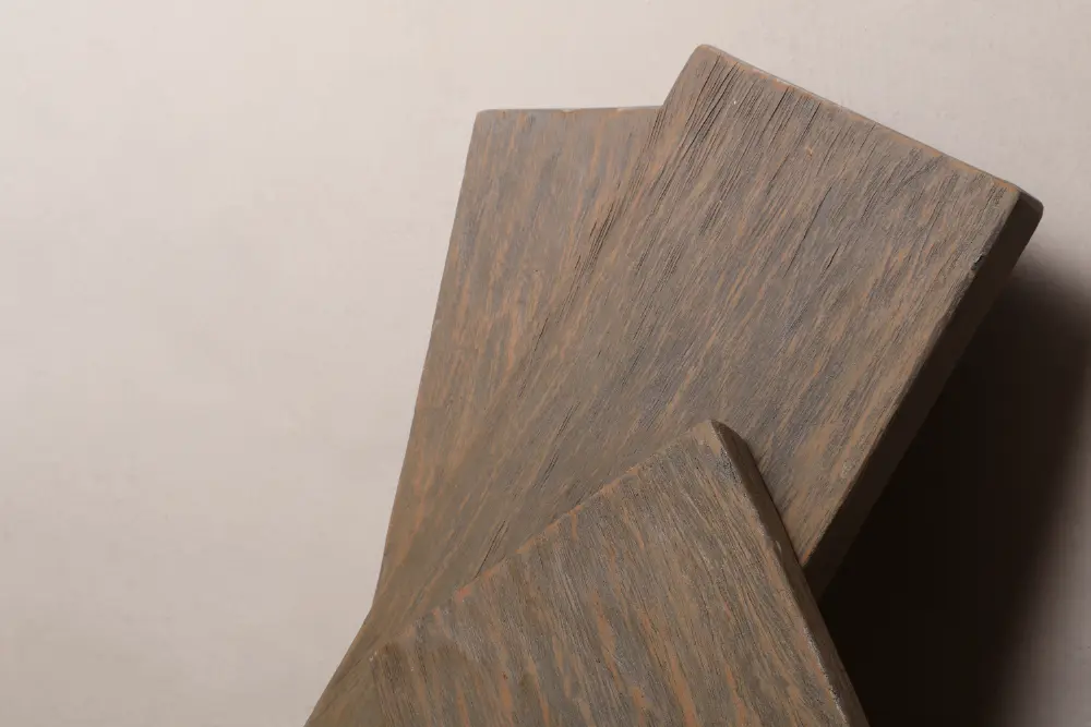 Sample of weathered furniture wood finish, demonstrating a rich, multi-tone rustic wash with significant depth and color variation.