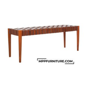 Fole Bench with handwoven cognac leather seat and solid sungkai wood frame in honey finish, shown from side angle. A modern leather bedroom bench ideal for bedrooms, hallways, or hospitality interiors. Features 1x1 leather weave and tapered legs.