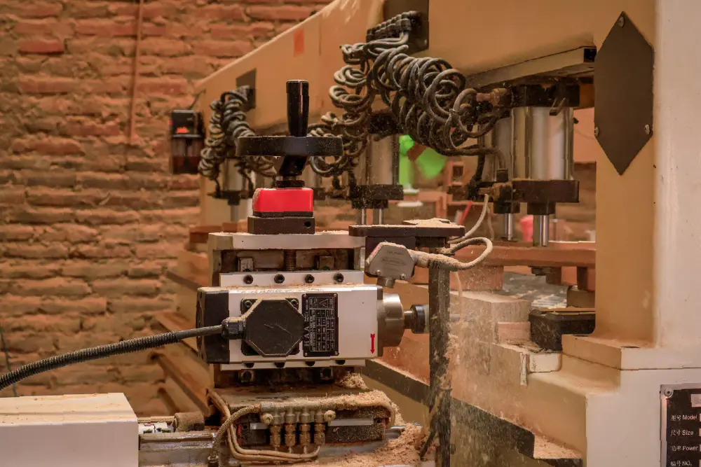 Close-up of a modern CNC Router ensuring high-precision, repeatable cuts at a reliable Indonesian furniture manufacturer factory.