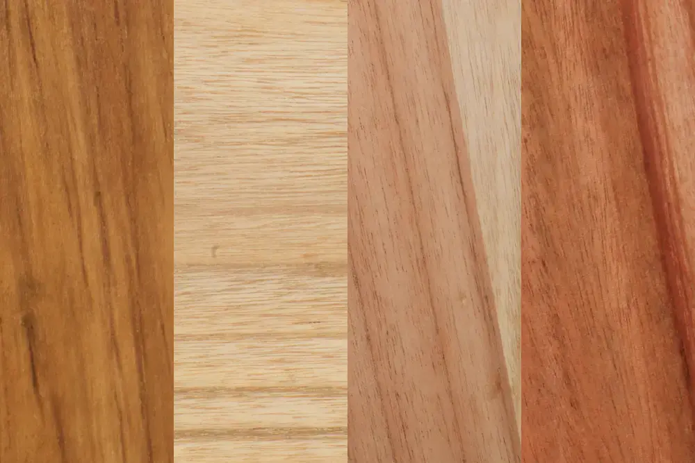 A side-by-side comparison of four distinct wood grain samples ranging from light blonde to deep reddish-brown, displaying the variety of timber species and finishes available for custom Indonesian outdoor furniture.