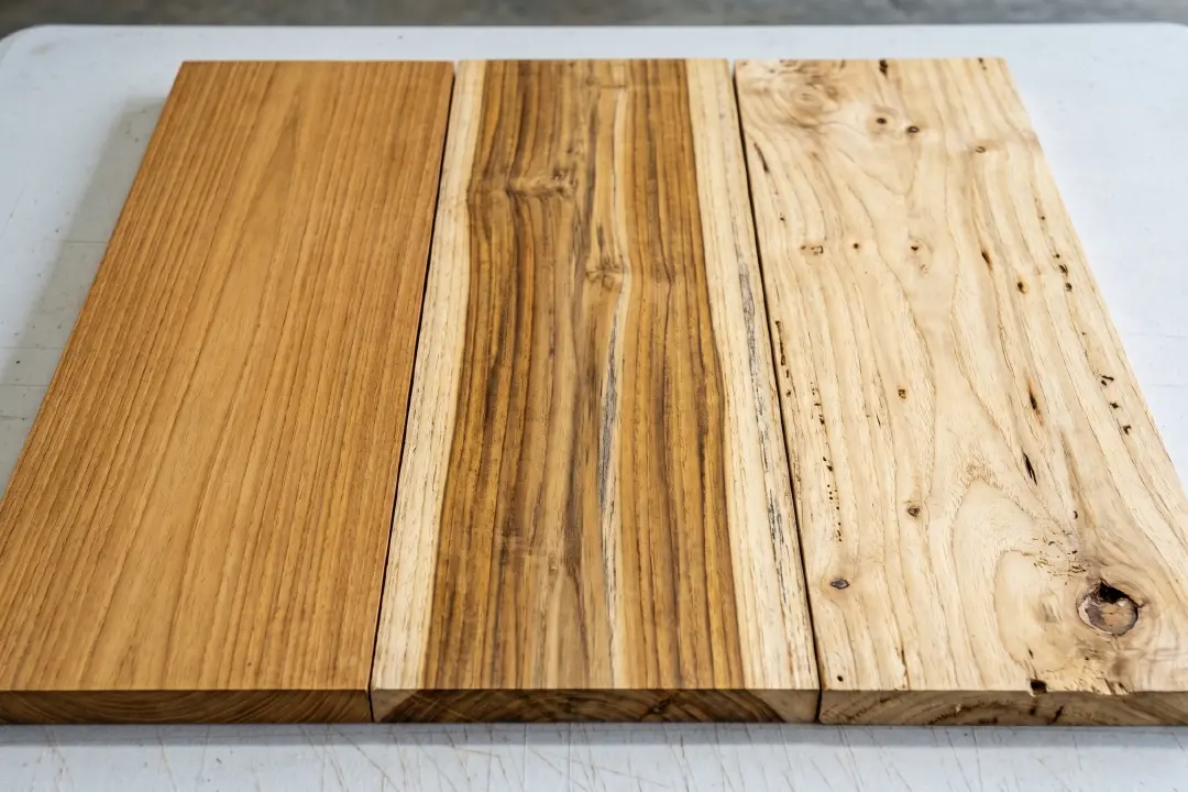 Comparation of teak wood grade. One is full of heartwood and other is still having a sapwood