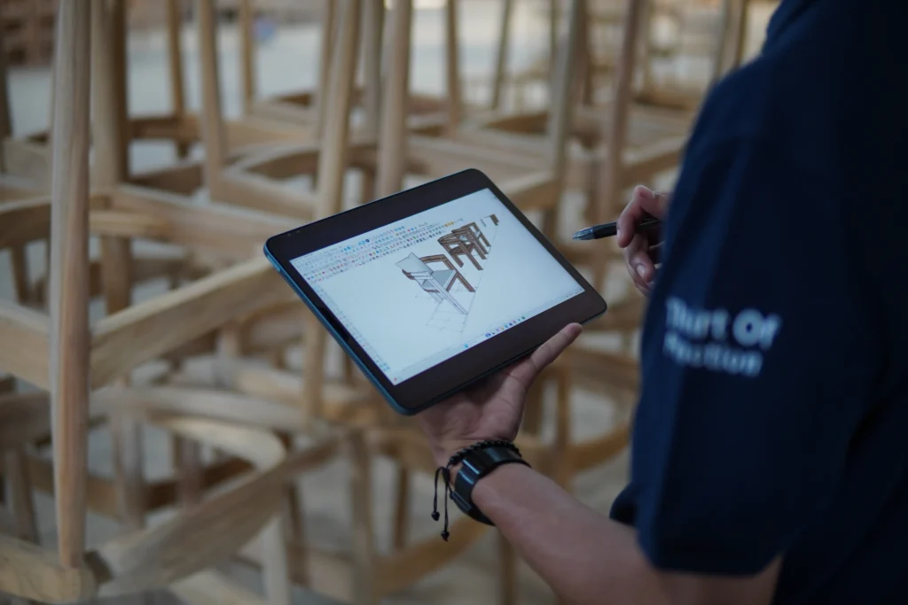 MPP Furniture team as an Indonesian Furniture Manufacturers reviewing a minimalist outdoor furniture prototype before bulk production