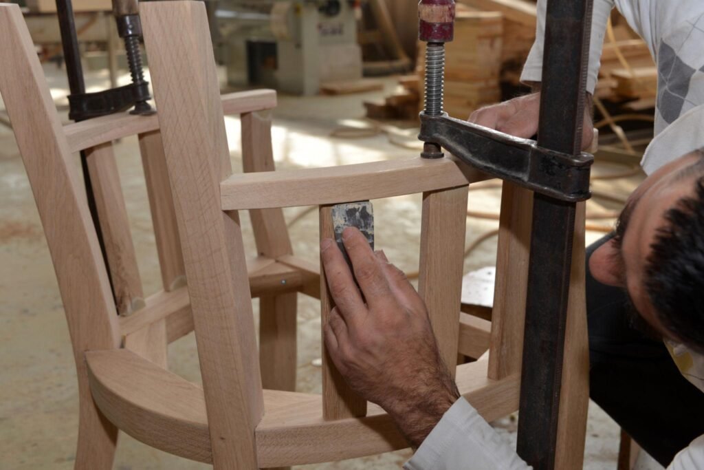 Quality control inspection of sungkai wood furniture joinery and finishing in a factory
