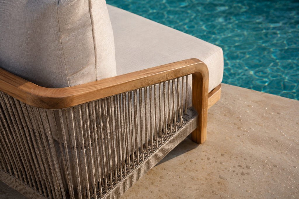 Close-up of poolside furniture materials showing teak frame, outdoor rope weaving, quick-dry cushion, and water droplets